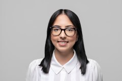 headshot young female executive glasses