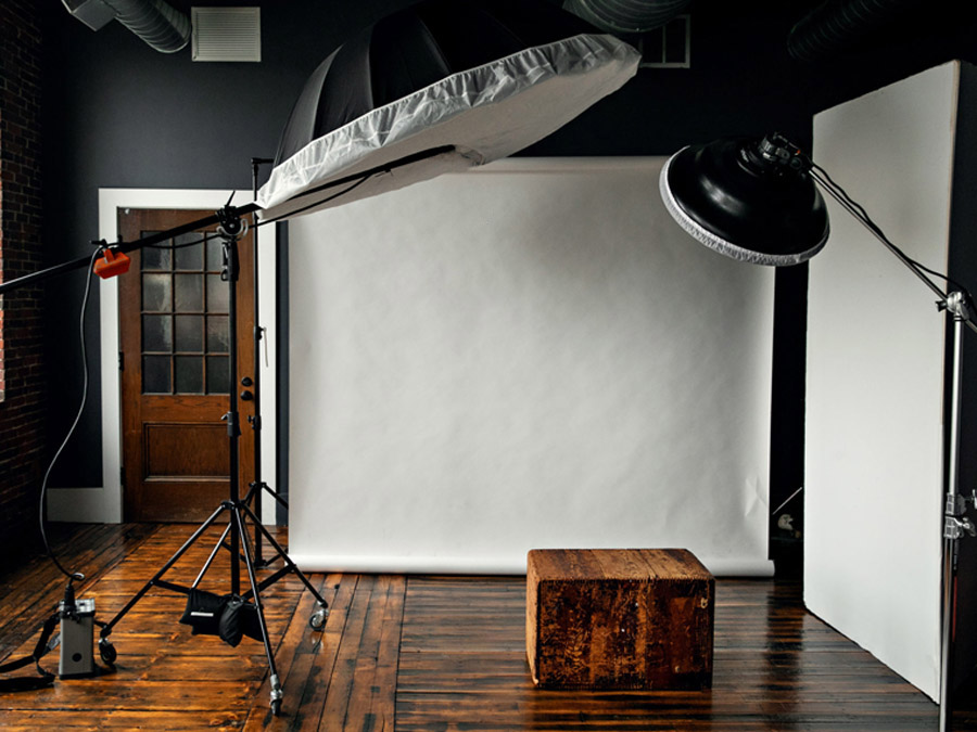 professional photography studio in lowell, massachusetts with lighting equipment and wood floors
