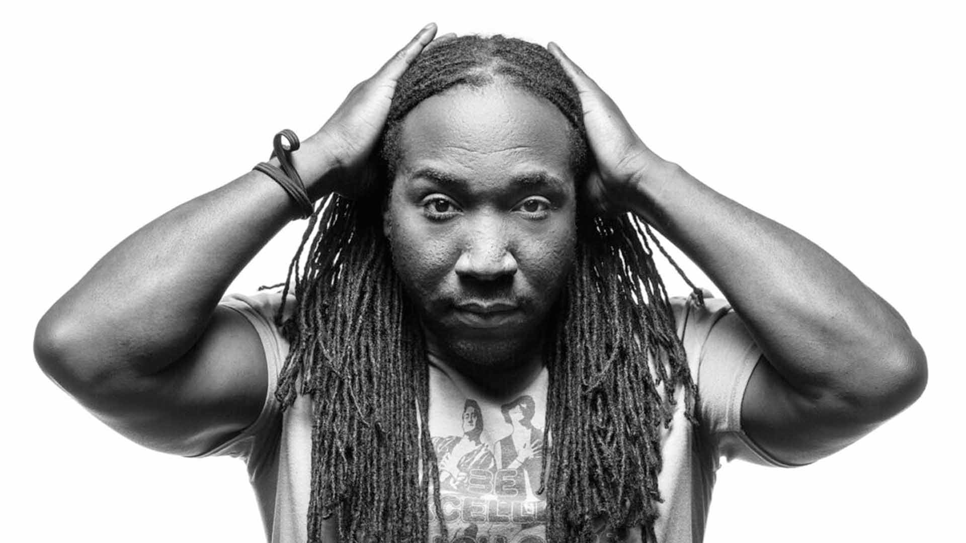 headshot portrait of an actor with dreadlocks black and white